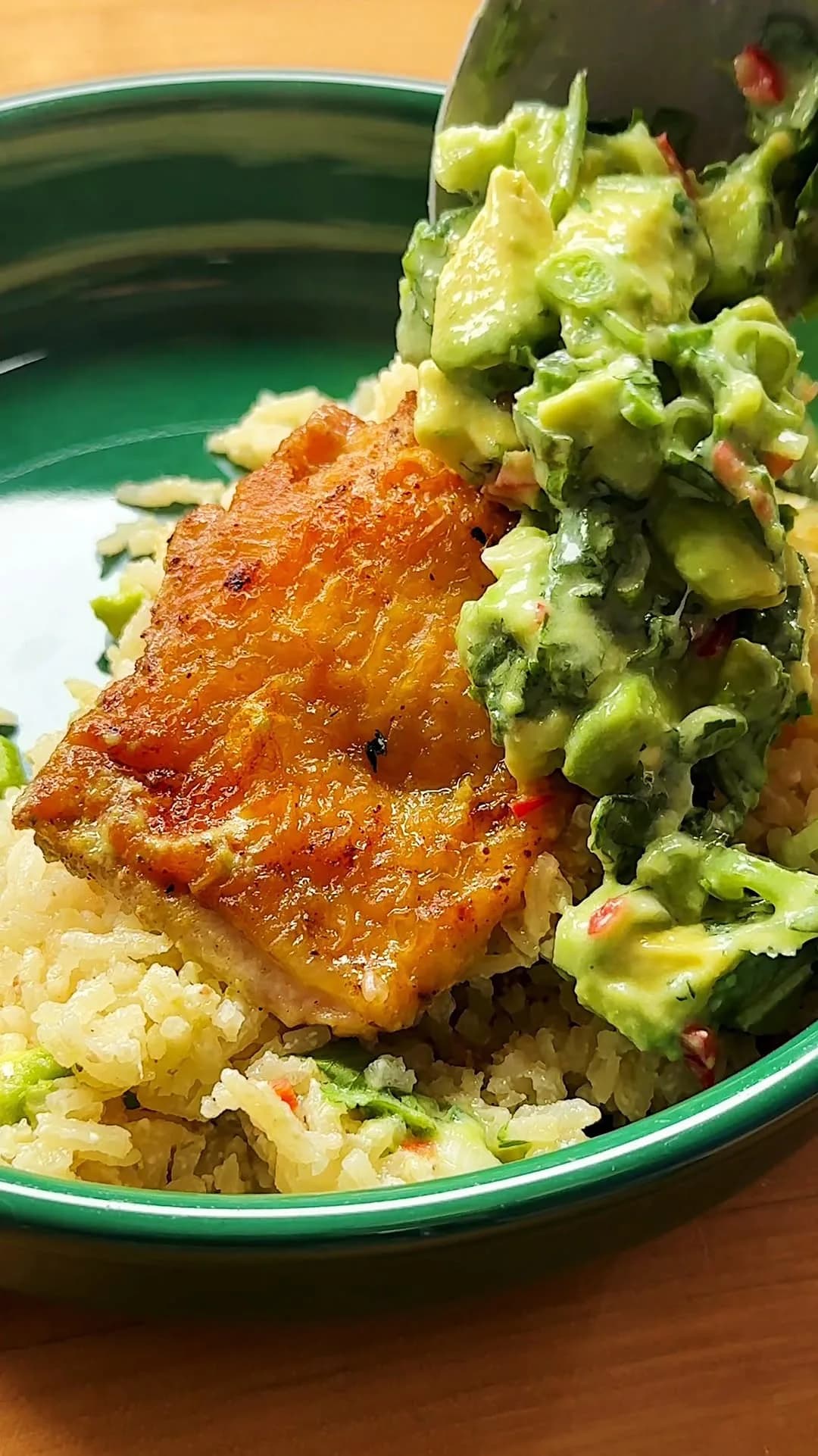 ONE PAN COCONUT LIME CHICKEN AND RICE with avocado salsa — a light, simple meal that doesn’t shy away from bright, citrusy flavors. Golden chicken thighs seared in @latourangelle avocado oil, fluffy coconut lime rice and a creamy avocado coconut salsa: Dump it all together in one pan and dinner is ready! #latourangellepartner
Ingredients (4 servings)
1 cup jasmine rice
5 to 6 skin-on chicken thighs
1 chicken bouillon cube, crushed
Salt and black pepper
4 tablespoons avocado oil
1 cup canned coconut milk, plus 2 tablespoons for topping
1 cup water
Zest and juice of one lime, plus 1 lime for topping
6 garlic cloves, peeled
2-inch ginger knob, sliced
1 large avocado, peeled and cubed
1 hot peppers, finely diced, such as Serrano or Fresno
1 bunch cilantro, chopped
3 scallions, thinly sliced
Heat the oven to 425°F (215°C).
Thoroughly wash the rice. Set aside to drain. Pat dry the thighs using a paper towel. Add to a bowl alongside the bouillon cube, salt and pepper. Add the avocado oil and toss to evenly coat.
Heat a 12-inch skillet over medium heat. Place the chicken skin-side down and cook for 6 to 8 minutes, until golden. Adjust the heat as needed. Flip and cook for 4 minutes. Transfer the chicken to a clean plate.
To the skillet, add the rice and toast, stirring occasionally, for 4 to 6 minutes, until lightly golden. Carefully add the water, 1 cup coconut milk, zest and juice of 1 lime, garlic, ginger and a big pinch of salt. Place the chicken, skin side-up in the skillet and any leftover juices from the plate.
Bring to a simmer and cover with a lid. Place in the oven for 15 minutes. Turn off the oven and allow the skillet to sit, with the lid on, for 10 more minutes in the oven. Broil before serving to crisp up the chicken skin, if you like.
Meanwhile, make the topping: In a mixing bowl, combine the avocado, pepper, cilantro, scallions, remaining 2 tablespoons coconut milk and juice of 1 lime. Season with salt and add dollops of the mixture to the skillet, before serving.
#dinner #onepanmeal #chicken #rice